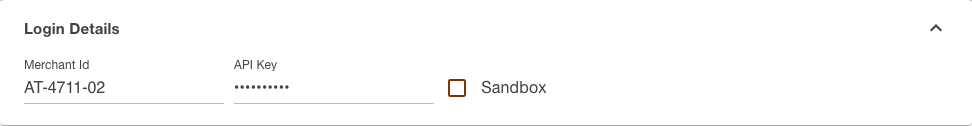 Login details section of the Shöpping channel with the merchant id entered, the API key masked and the empty Sandbox checkbox